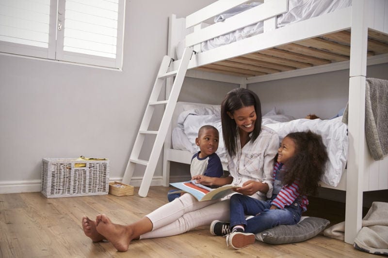 Mother Reading to Her Kids